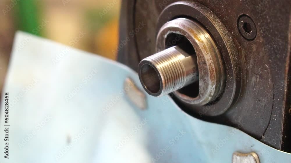 metalworking industry: close up hole drilling in copper bars for electrical connection on lathe boring machine with lubricant metalworking industry: close up hole drilling in copper bars for electrical connection on lathe boring machine with lubricant