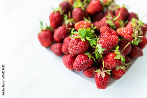 Ripe picked strawberries on the table. Collection of fresh organic strawberries. Delicious and sweet berry.