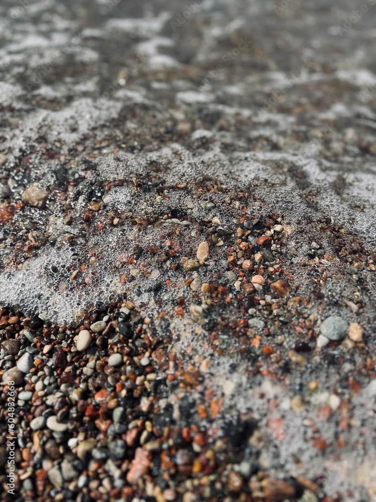 Natural sea pebbles, wet pebbles, small pebble background Natural sea pebbles, wet pebbles, small pebble background