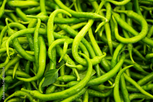 Green chilli close-up. Fresh Vegetables Background. Chili peppers.  © Elly Miller