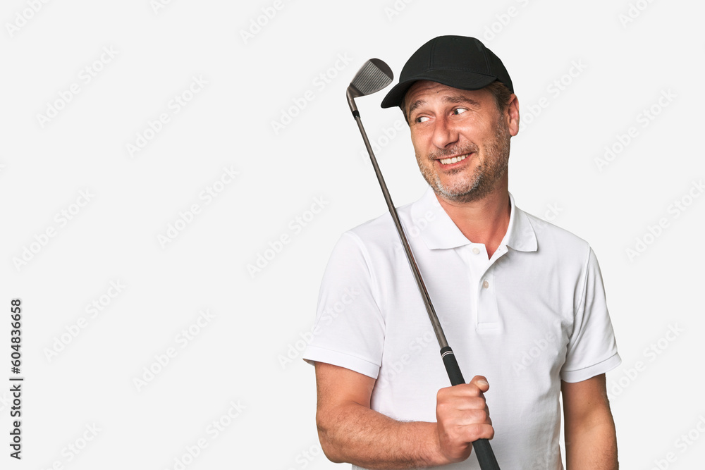 Middle aged golfer man looks aside smiling, cheerful and pleasant. Middle aged golfer man looks aside smiling, cheerful and pleasant.
