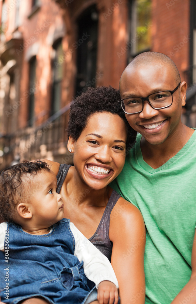 Family smiling together on city street Family smiling together on city street