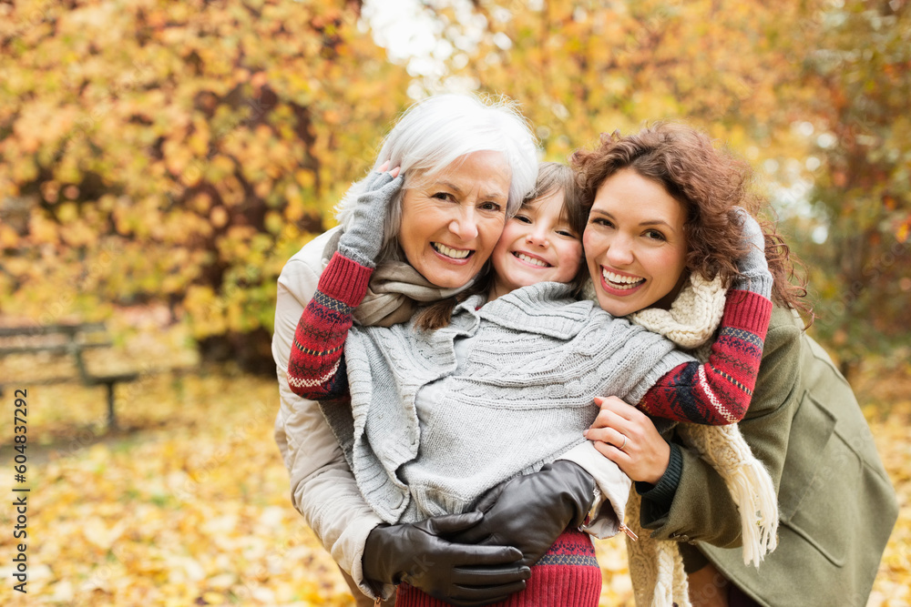 Three generations of women smiling in park Three generations of women smiling in park