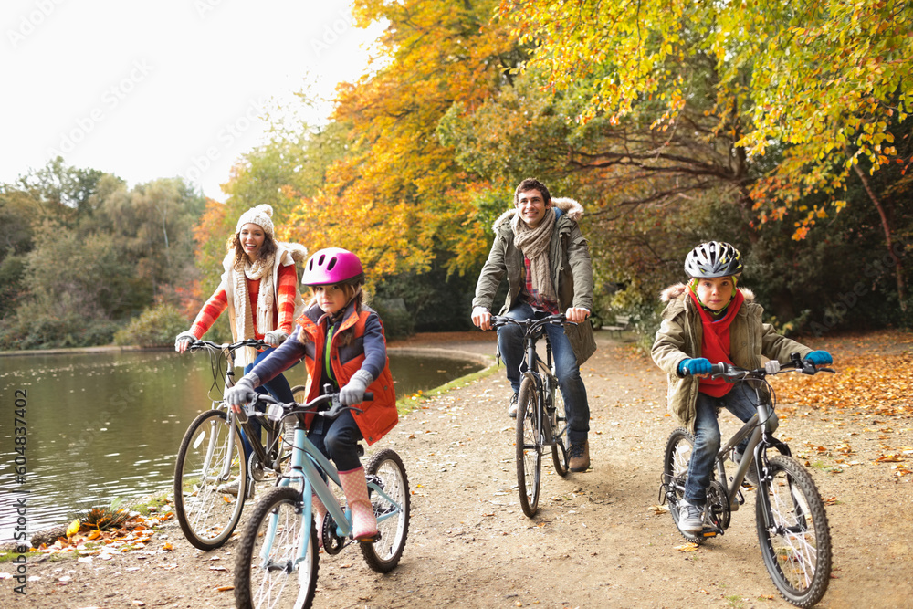 Family riding bicycles in park