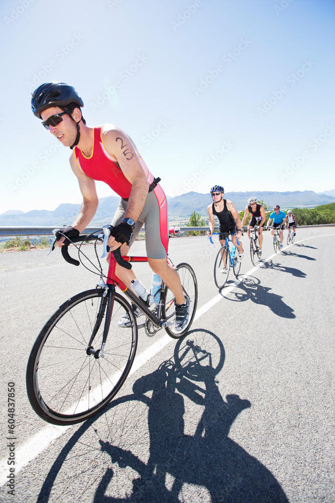 Cyclists in race on rural road