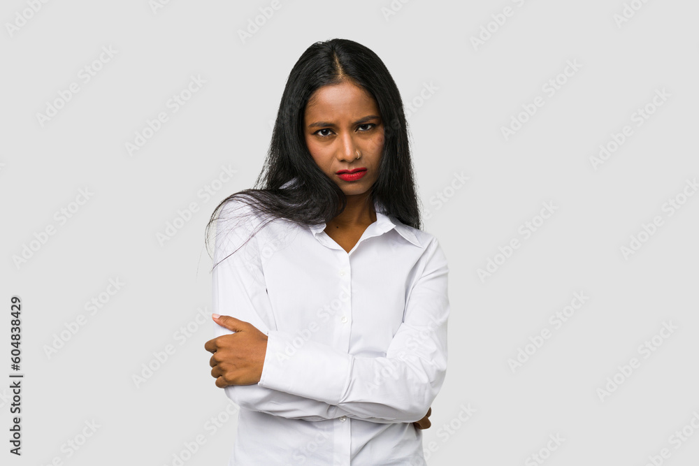 Young Indian woman cut out isolated on white background who is bored, fatigued and need a relax day. Young Indian woman cut out isolated on white background who is bored, fatigued and need a relax day.