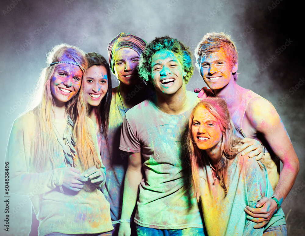Fototapeta premium Portrait of friends covered in chalk dye at music festival