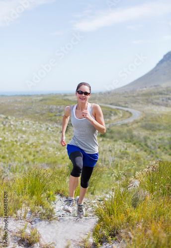Woman running on dirt path