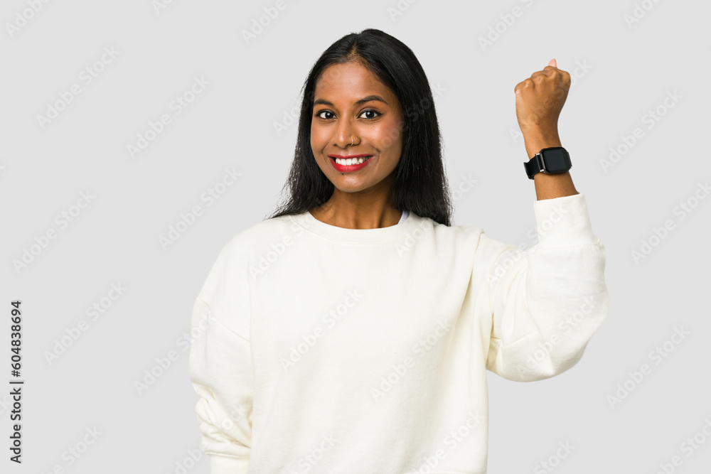 Young Indian woman wearing a hand watch isolated on white background Young Indian woman wearing a hand watch isolated on white background