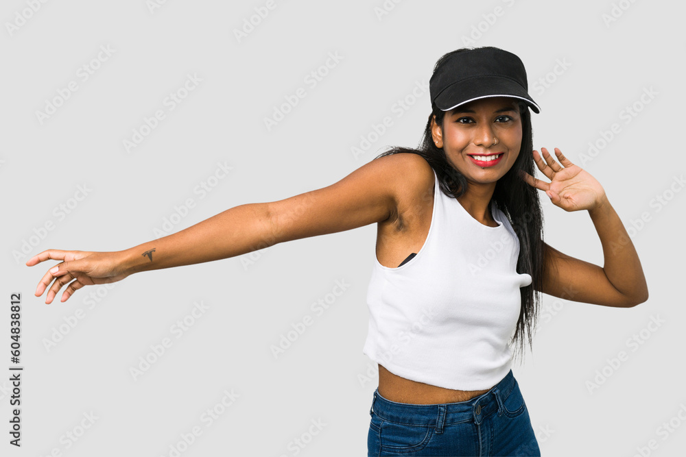 Young Indian woman dancing cut out isolated on white background Young Indian woman dancing cut out isolated on white background