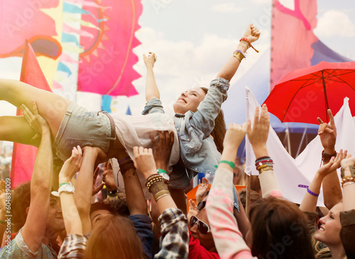 Canvas Print Woman crowd surfing at music festival