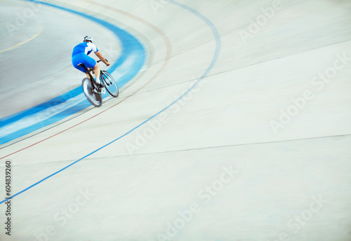 Fototapeta Naklejka Na Ścianę i Meble -  Track cyclist riding around velodrome