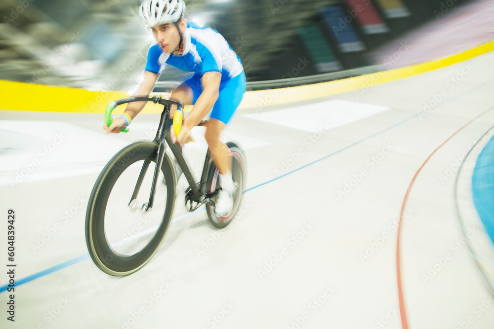Fototapeta premium Track cyclist riding in velodrome