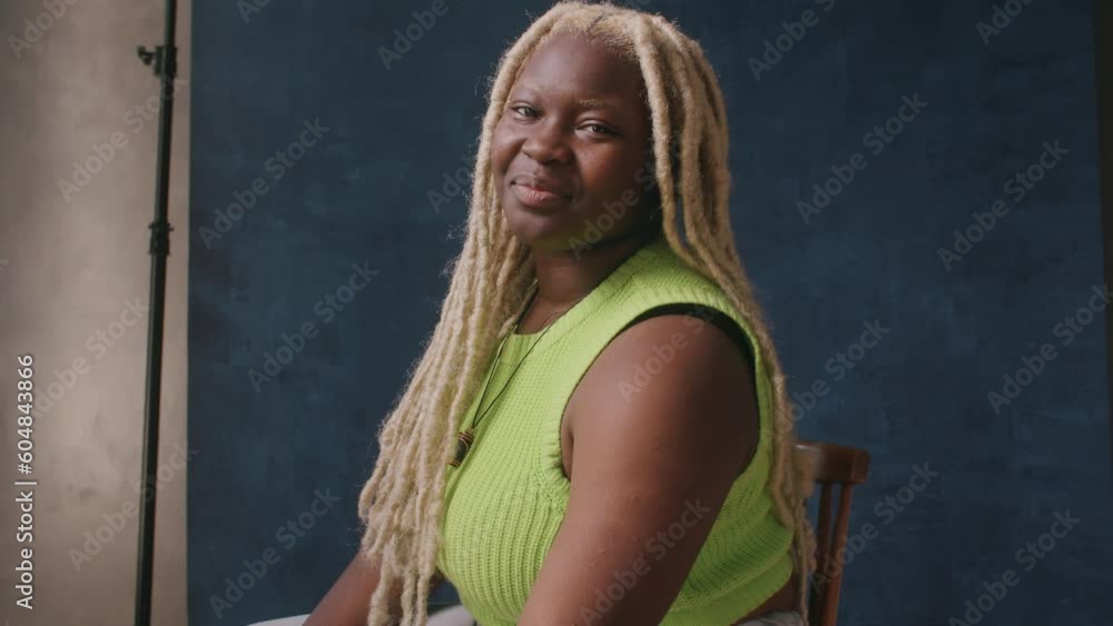 Closeup shot of lesbian woman with dyed blonde hair smiling and laughing Closeup shot of lesbian woman with dyed blonde hair smiling and laughing