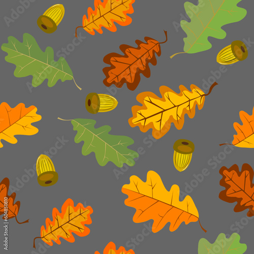 Рattern with autumn leaves.Oak leaves and 
acorns on the pavement are falling