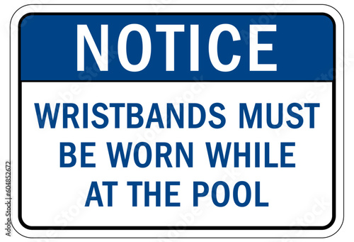 Pool pass required sign and labels wristbands must be worn while at the pool