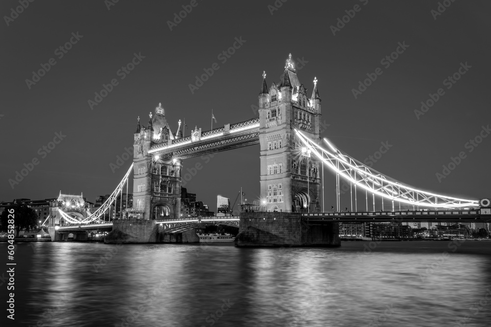 The Tower Bridge and the river Thames at night in London, UK