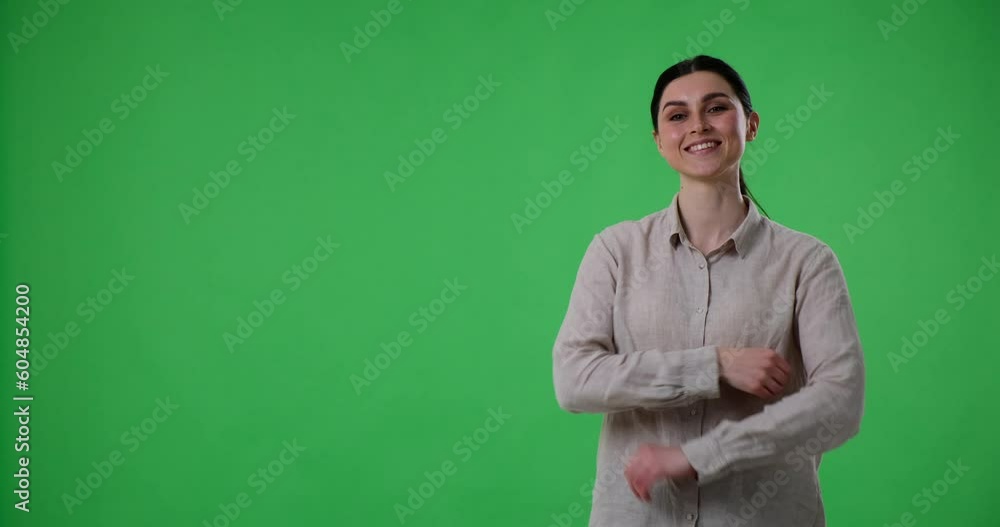 Confident woman is standing on a green background and pointing to the left side of the frame while presenting three options. With her index finger, she directs the viewer's attention to the choices. Confident woman is standing on a green background and pointing to the left side of the frame while presenting three options. With her index finger, she directs the viewer's attention to the choices.