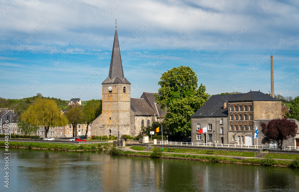 View of Givet with historical Notre-Dame church, picturesque little town on the river Meuse in the northern France View of Givet with historical Notre-Dame church, picturesque little town on the river Meuse in the northern France