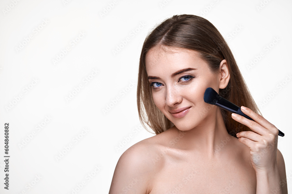 smiling lovely lady posing with make-up brush for powder smiling lovely lady posing with make-up brush for powder