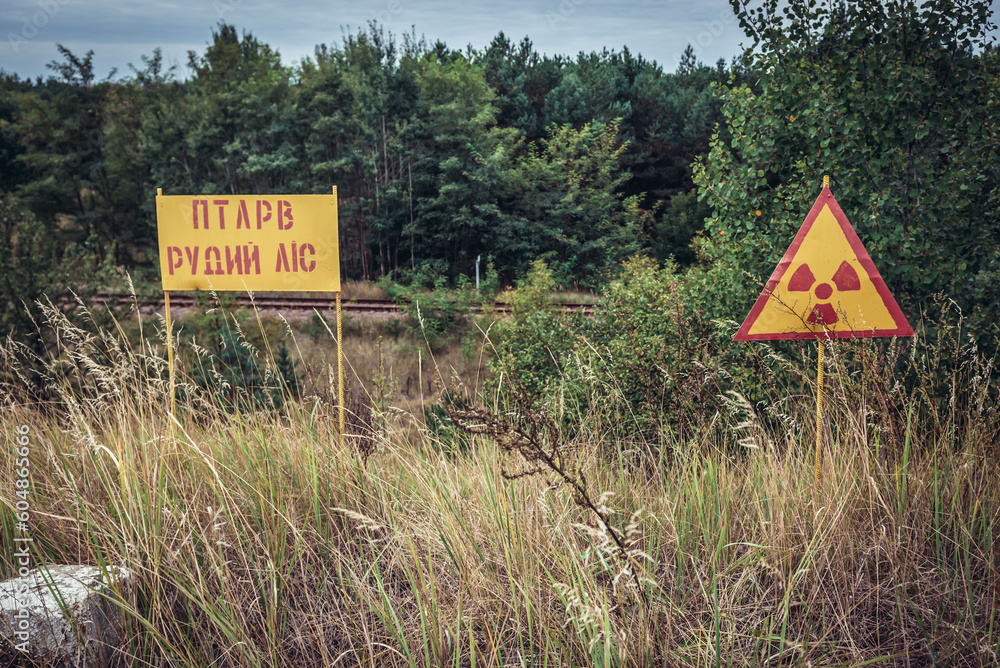 Radiation warning sign in so called Red Forest area in Chernobyl Exclusion Zone, Ukraine