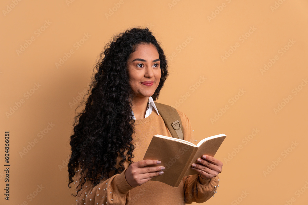 happy african american woman reading book to study in studio shot. back to school, student life concept. happy african american woman reading book to study in studio shot. back to school, student life concept.