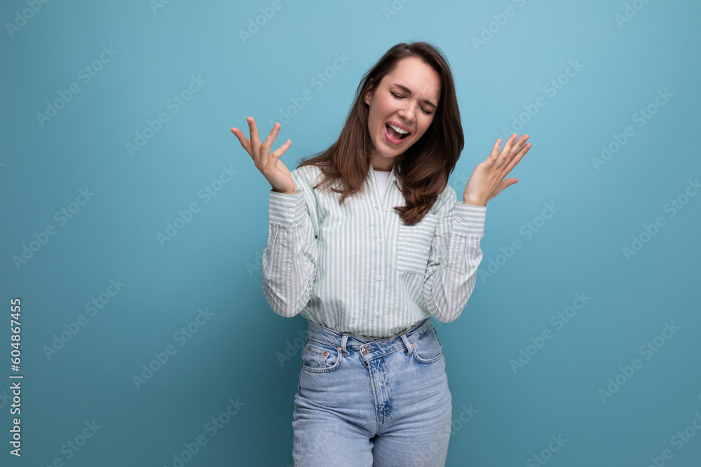 funny laughing young brunette woman in shirt on studio background funny laughing young brunette woman in shirt on studio background
