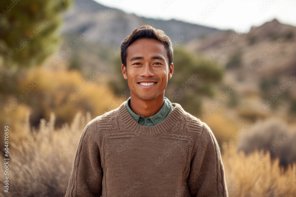 Lifestyle portrait photography of a satisfied boy in his 30s wearing a cozy sweater against a national park background. With generative AI technology Lifestyle portrait photography of a satisfied boy in his 30s wearing a cozy sweater against a national park background. With generative AI technology