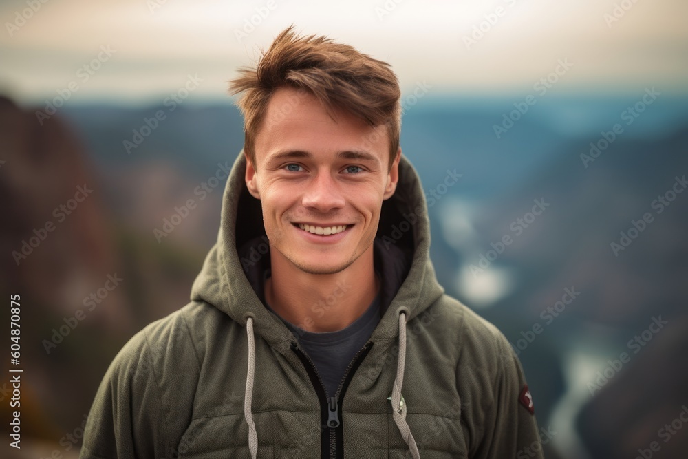 Close-up portrait photography of a grinning boy in his 30s wearing a cozy zip-up hoodie against a national park background. With generative AI technology Close-up portrait photography of a grinning boy in his 30s wearing a cozy zip-up hoodie against a national park background. With generative AI technology