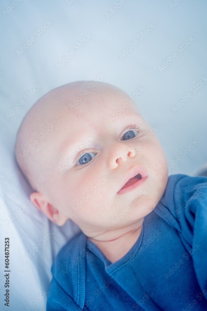 portrait, expression of a cute baby with blue eyes portrait, expression of a cute baby with blue eyes