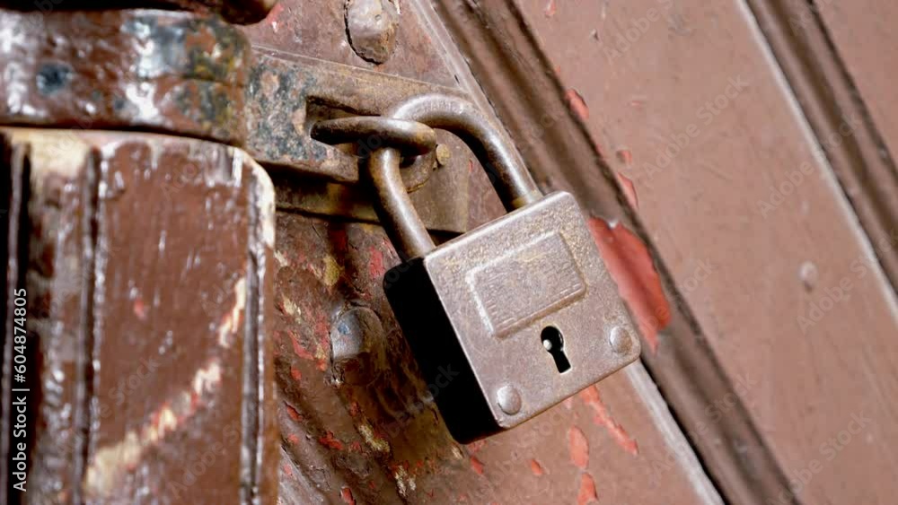 Padlock on the wooden doors of the historic cathedral