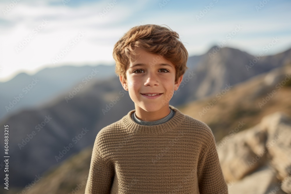 Lifestyle portrait photography of a glad kid male wearing a cozy sweater against a scenic mountain overlook background. With generative AI technology Lifestyle portrait photography of a glad kid male wearing a cozy sweater against a scenic mountain overlook background. With generative AI technology