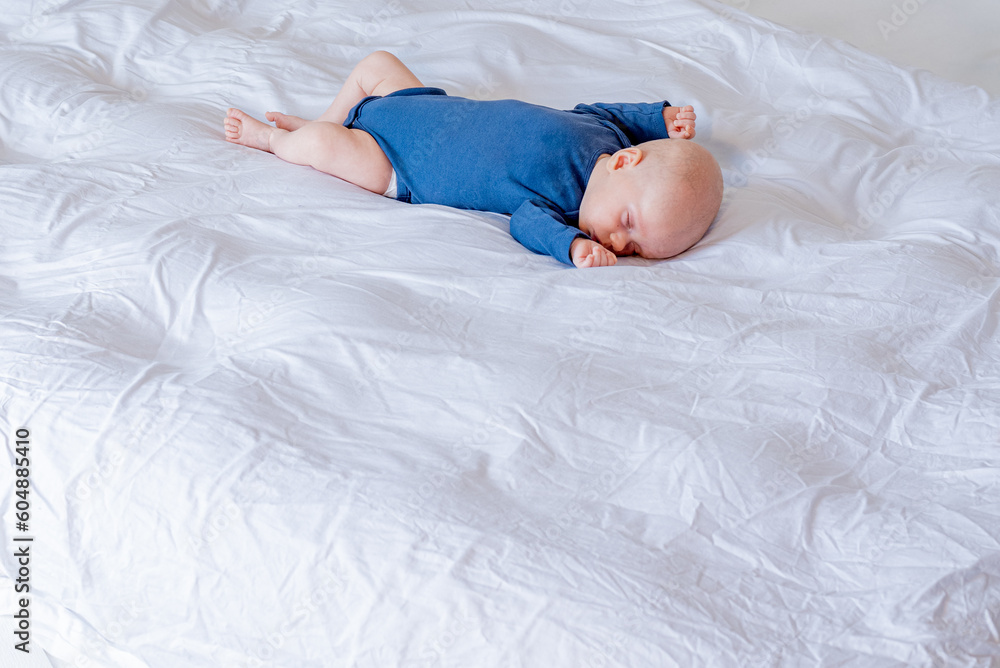 Child sleeping in bed. Background with space for text. Child sleeping in bed. Background with space for text.