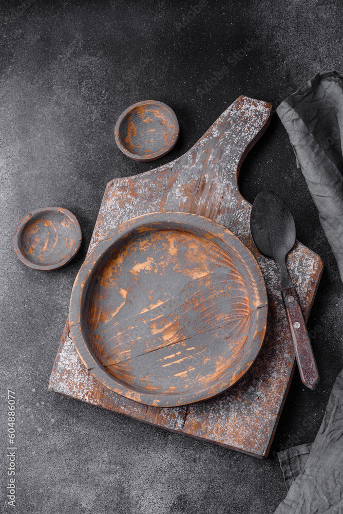 Empty wooden plate, knife, fork and cutting board Empty wooden plate, knife, fork and cutting board
