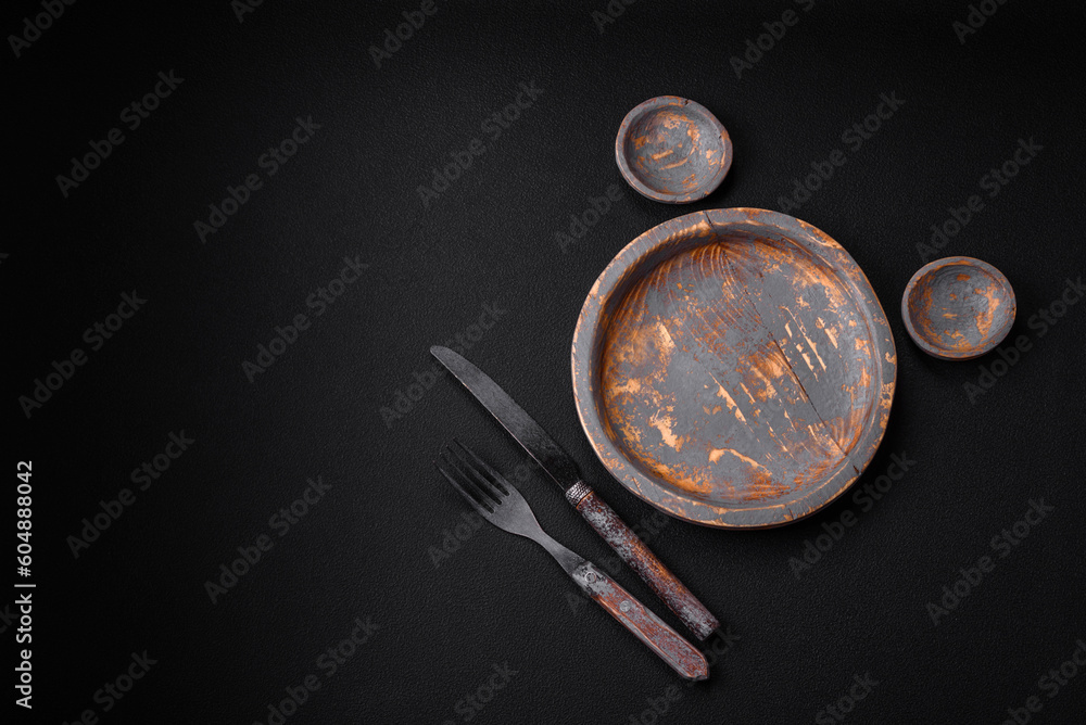 Empty wooden plate, knife, fork and cutting board Empty wooden plate, knife, fork and cutting board