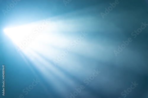 blue spotlight light beam on black background