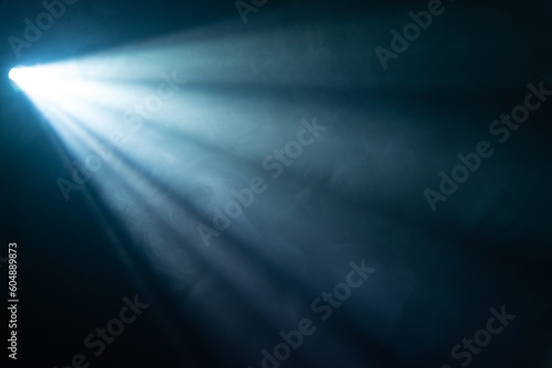 blue spotlight light beam on black background