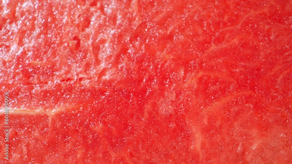 Macro video of watermelon with probe lens reveals its vibrant red flesh, dotted with black seeds. The lens captures intricate details, showcasing the fruit's refreshing. Macro dolly shot. 4K HDR
Macro video of watermelon with probe lens reveals its vibrant red flesh, dotted with black seeds. The lens captures intricate details, showcasing the fruit's refreshing. Macro dolly shot. 4K HDR