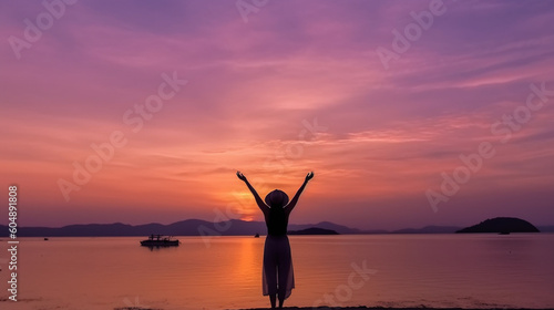 Happy woman silhouette in the sunset