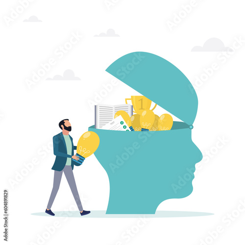 Upgrading skills, learning new things or developing knowledge for new skills. The concept of job qualification, the guy puts the ideas of a light bulb and a book in his head.
