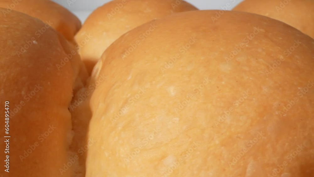 A captivating macro video showcases bread's enchanting details through a probe lens revealing its golden crust, airy texture, and delicate crumbs in exquisite close-up shots. Slide dolly shot. 4K
A captivating macro video showcases bread's enchanting details through a probe lens revealing its golden crust, airy texture, and delicate crumbs in exquisite close-up shots. Slide dolly shot. 4K