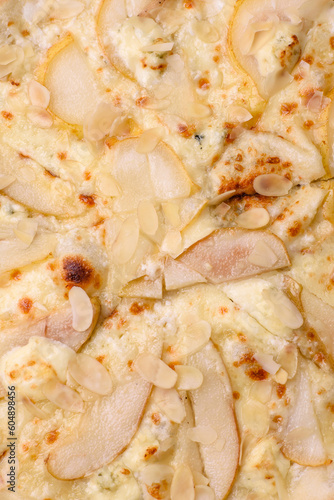 Delicious sweet pizza with pear, dorblu cheese and nuts