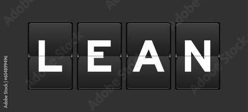 Black color analog flip board with word lean on gray background