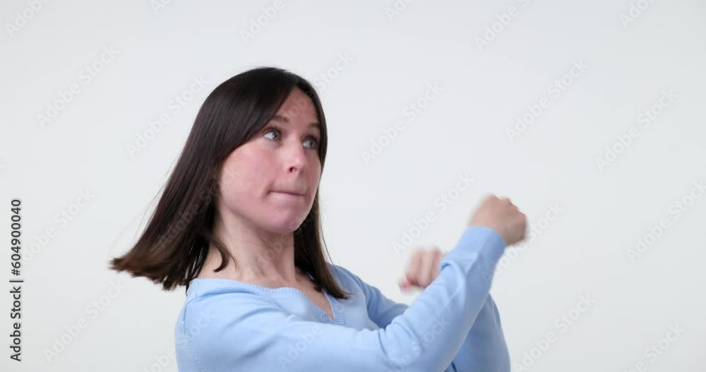 A joyful Caucasian woman dances carefree on a white background, her movements quick, daring, and lively. Her infectious energy and upbeat spirit are sure to lift any mood. A joyful Caucasian woman dances carefree on a white background, her movements quick, daring, and lively. Her infectious energy and upbeat spirit are sure to lift any mood.