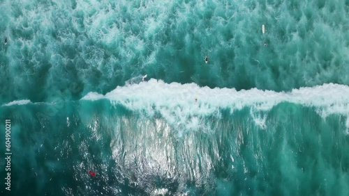 Aerial shot of surfers in Bali - Indonesia. photo