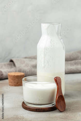 homemade yogurt, kefir, fermented milk on a light background. Healthy, clean eating. Vegan or gluten free diet photo