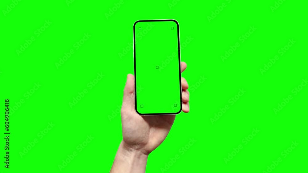 A man is holding a smartphone with a blank green screen featuring tracking marks, and he is touching with his finger the screen in the app. This serves as a template for your application