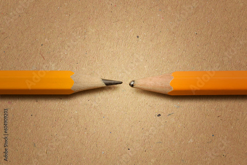 Photography Sharpened pencil versus dull pencil on recycled paper background - Concept of in