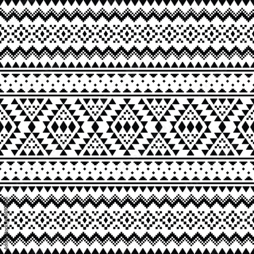 Geometric ethnic seamless pattern in Native American style. Pixel pattern with tribal Aztec motives in black and white color. Design for textile, fabric, clothing, curtain, rug, ornament, wallpaper.