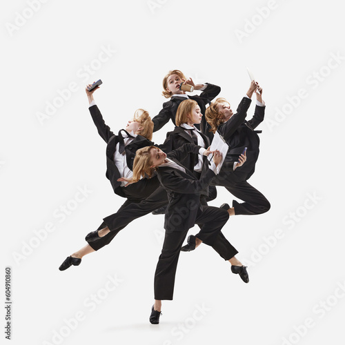 Portrait with busy blond girl, student, ballet dancer in costume working on project isolated over white background. Multitasking business woman photo